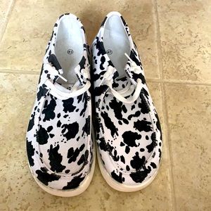 Cow Print slide-on shoes